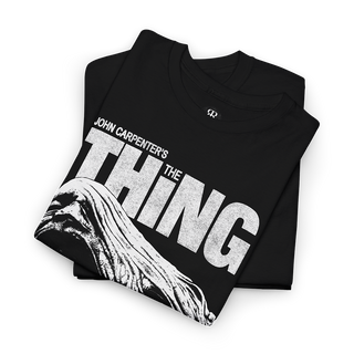 Black t-shirt with 'The Thing' graphic and text 'Man is the Warmest Place to Hide'.