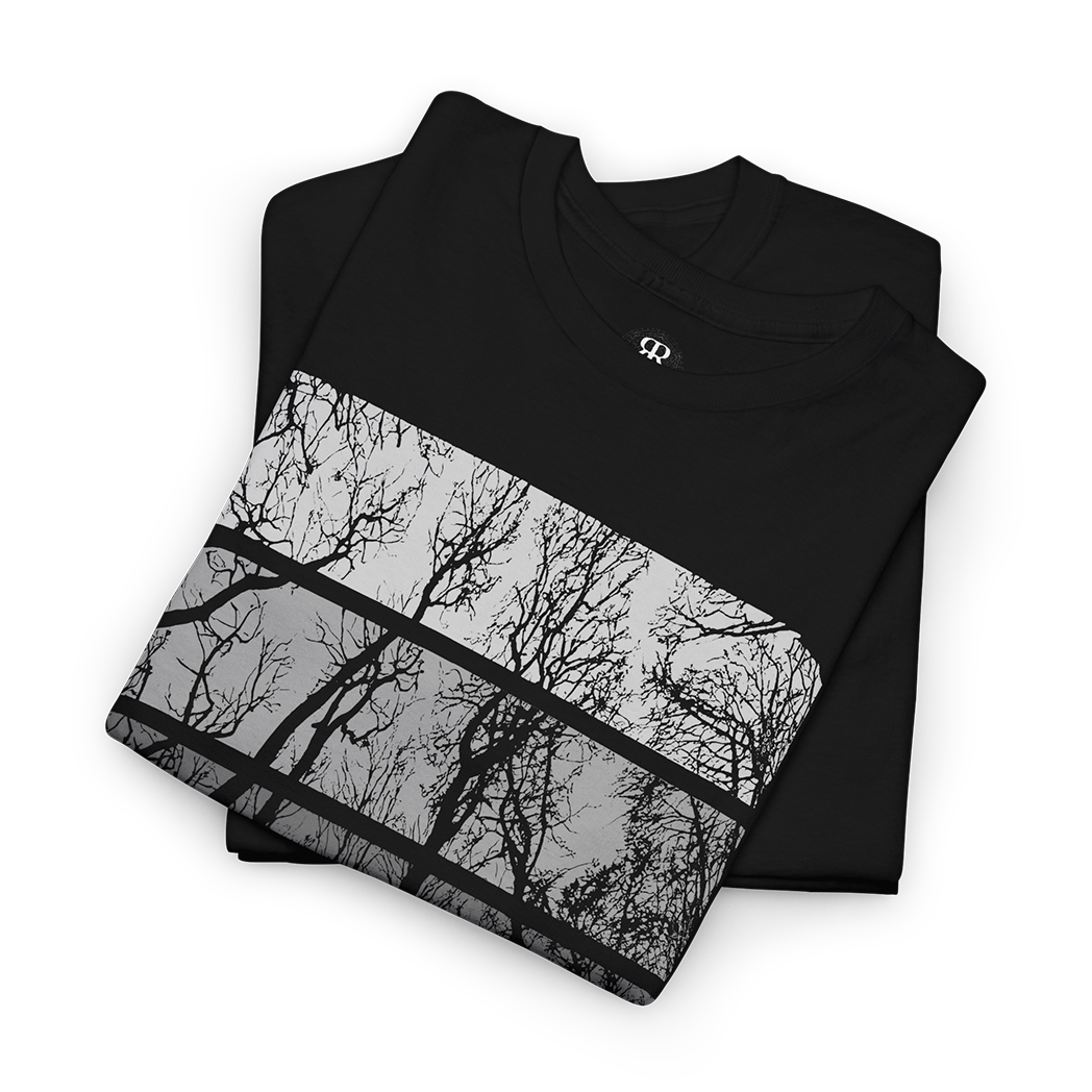 A black crew neck t-shirt with a graphic print of trees in a forest setting on the front.