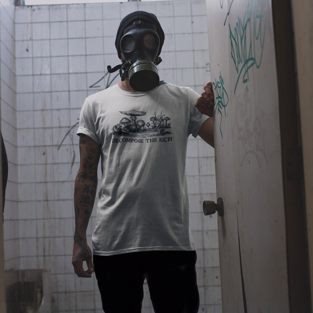 Person wearing a gas mask in a beige Decompose the Rich T-Shirt