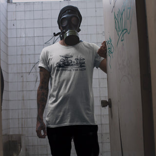 Person wearing a gas mask in a beige Decompose the Rich T-Shirt