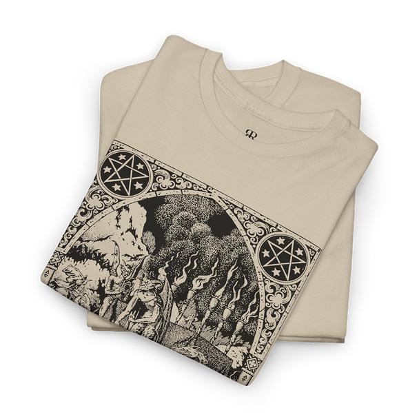 This image displays a beige t-shirt featuring a detailed and artistic print centered around the themes of witches and demons. 