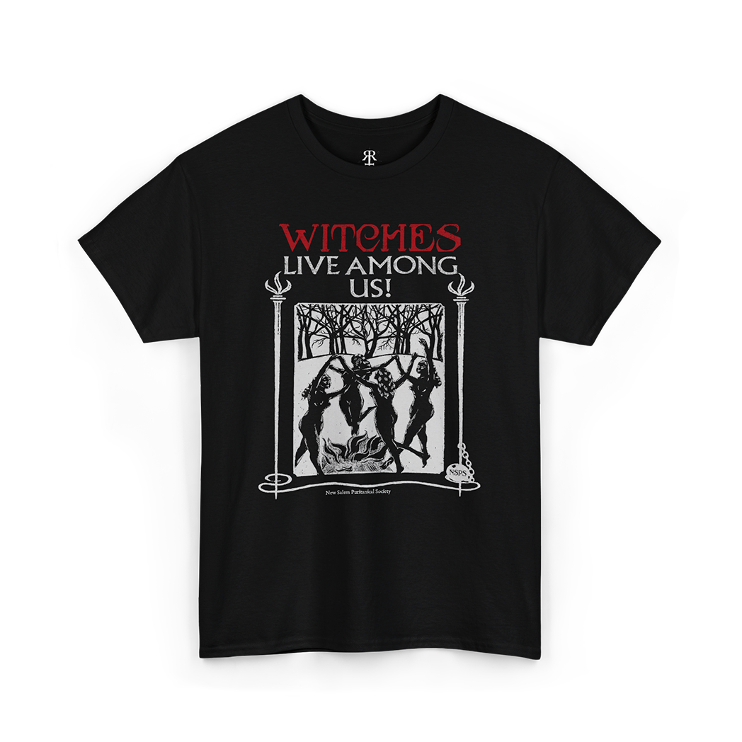 Black t-shirt with the text 'WITCHES LIVE AMONG US!' and an image of a witch and trees on it.