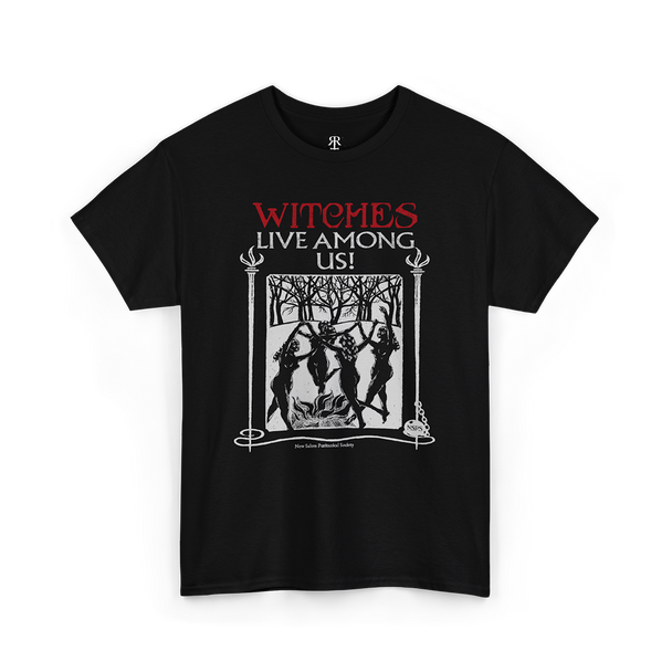 Black t-shirt with the text 'WITCHES LIVE AMONG US!' and an image of a witch and trees on it.