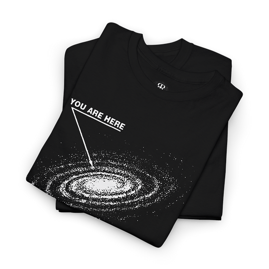 A black T-shirt with a graphic print of a galaxy and the text 'YOU ARE HERE' 